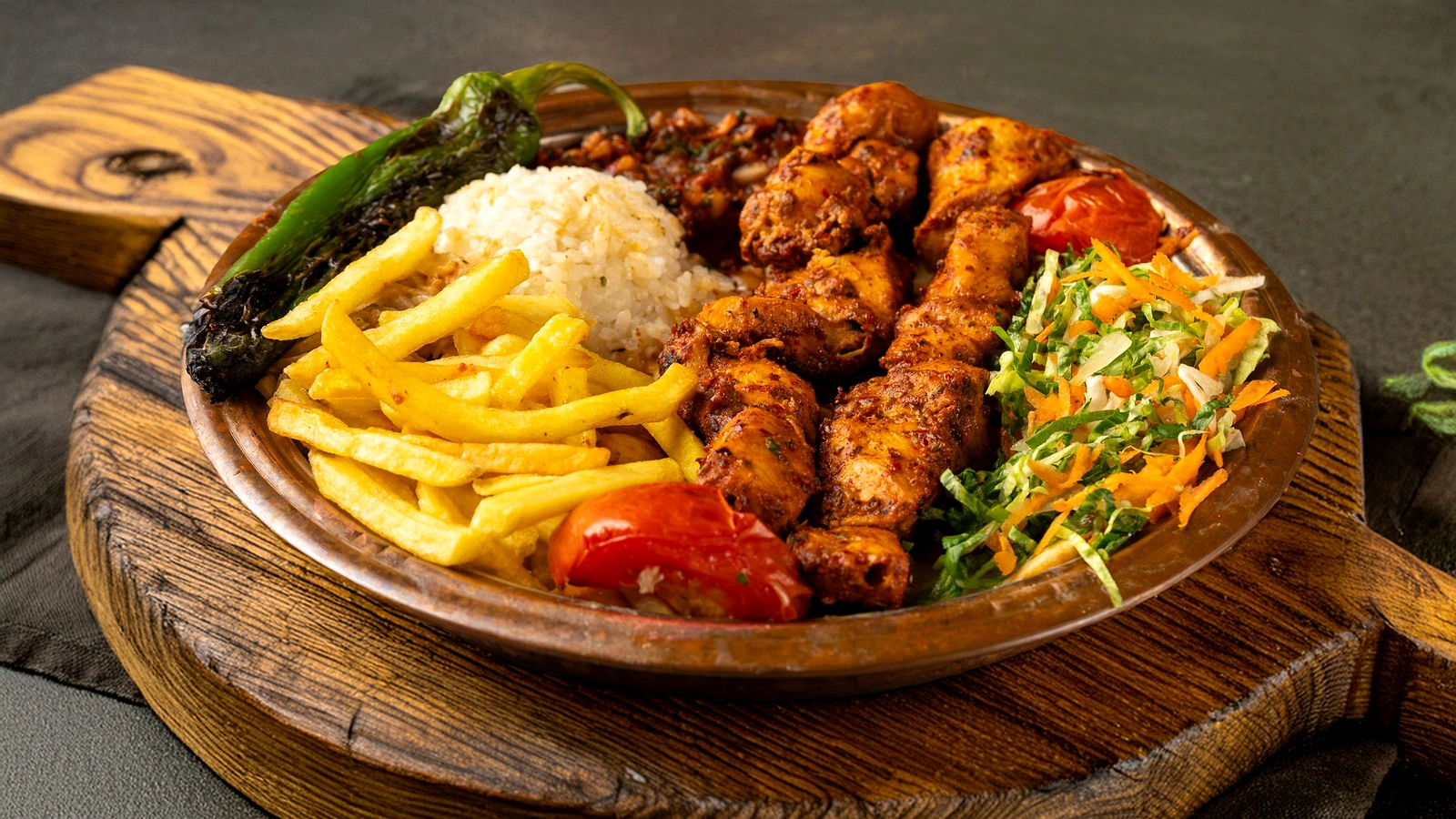 Grilled chicken platter with rice, chips and salad