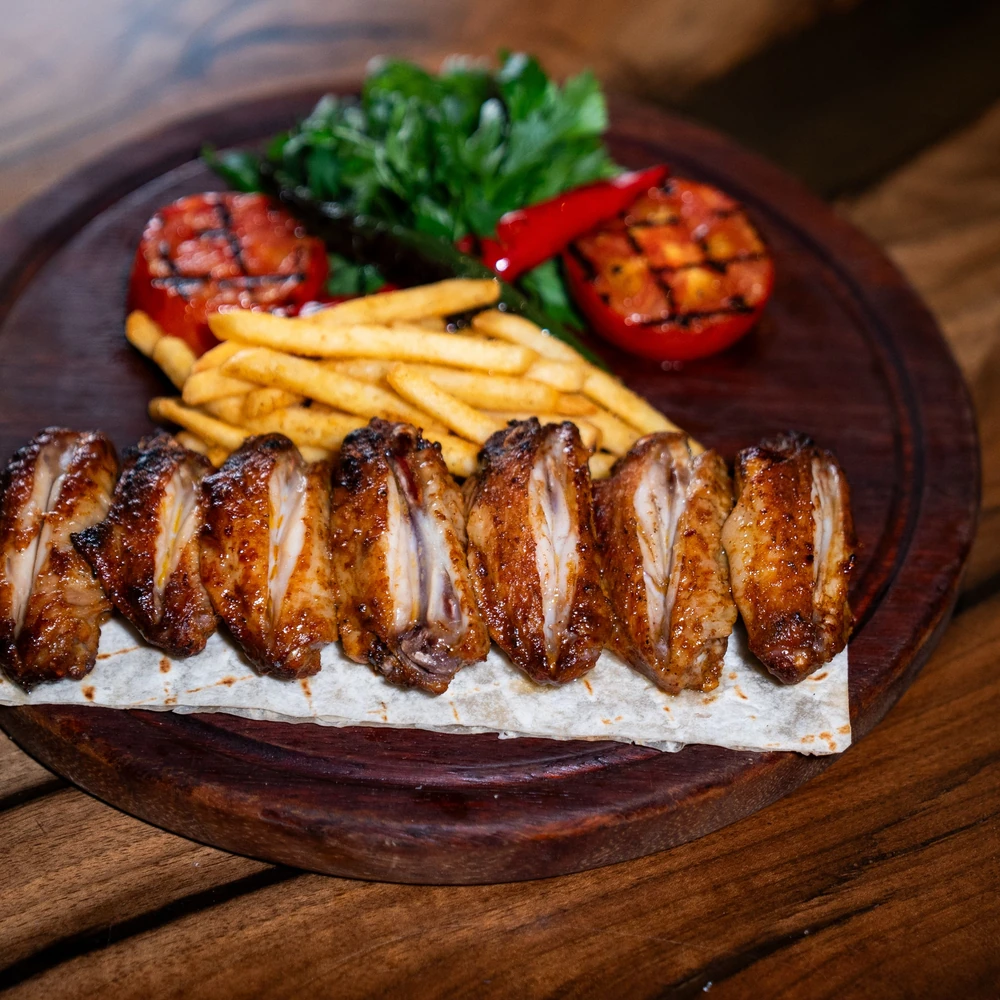 Grilled food and sides served as a generous sharing platter